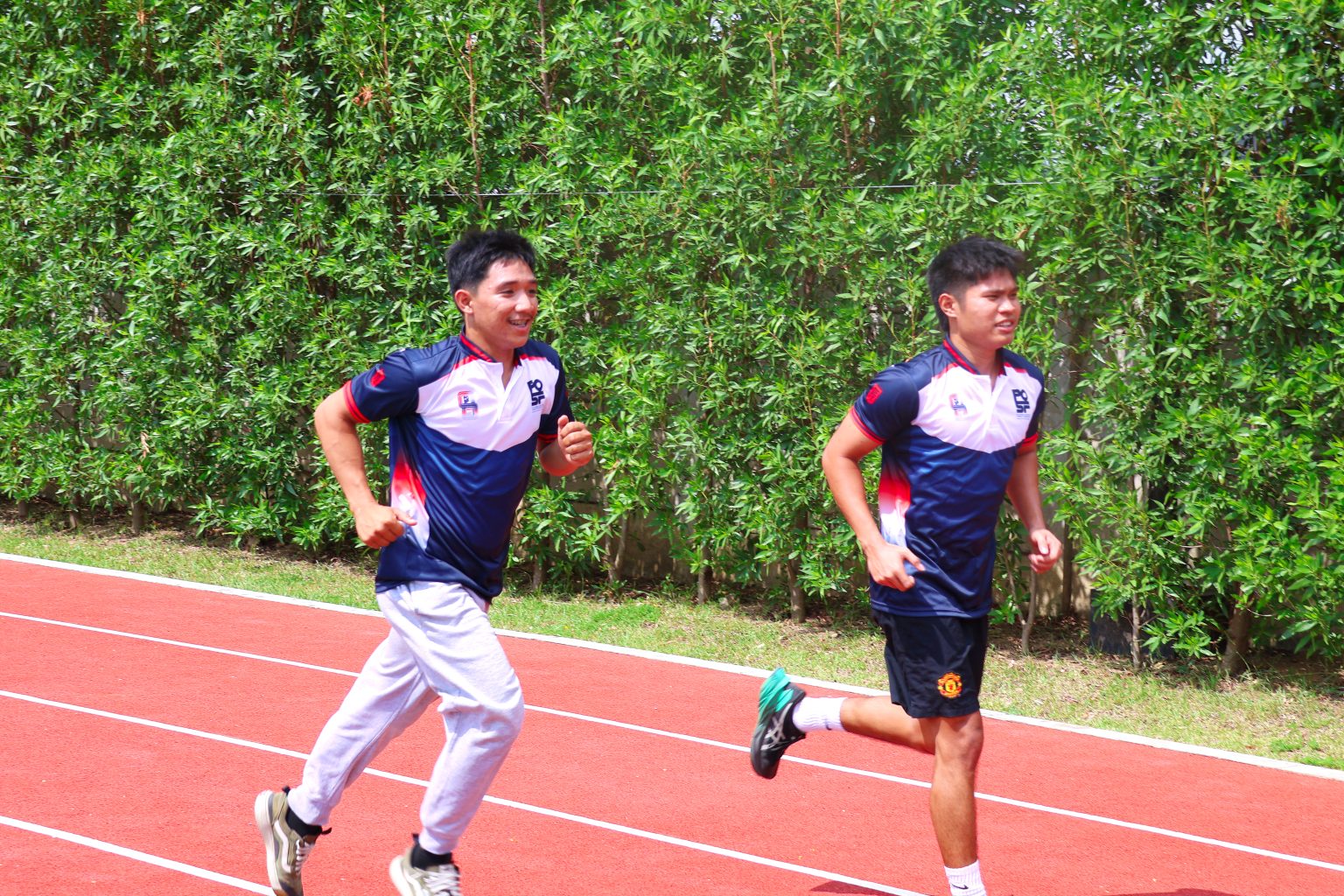 SEA Games Gold Medalist Ahgie Radan and Southeast Asia Championship Gold Medalist Zachary Ganacias running on the track at Fit Park Pueblo de Oro Townscpes Malvar